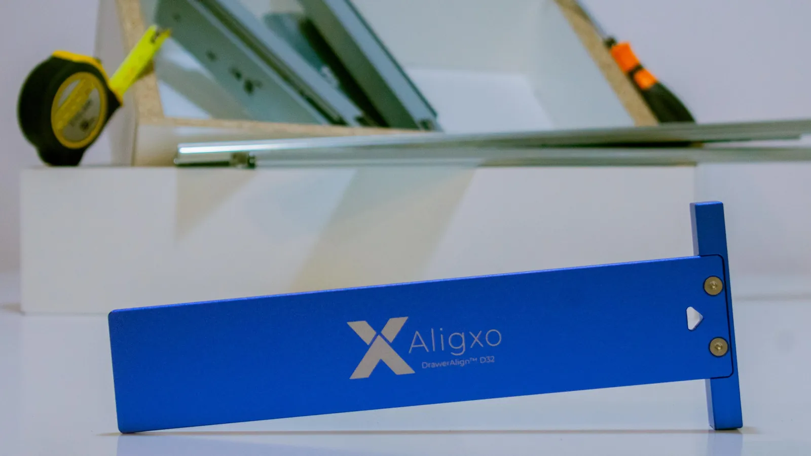 DrawerAlign D32 standing in front of a box of drawer slides