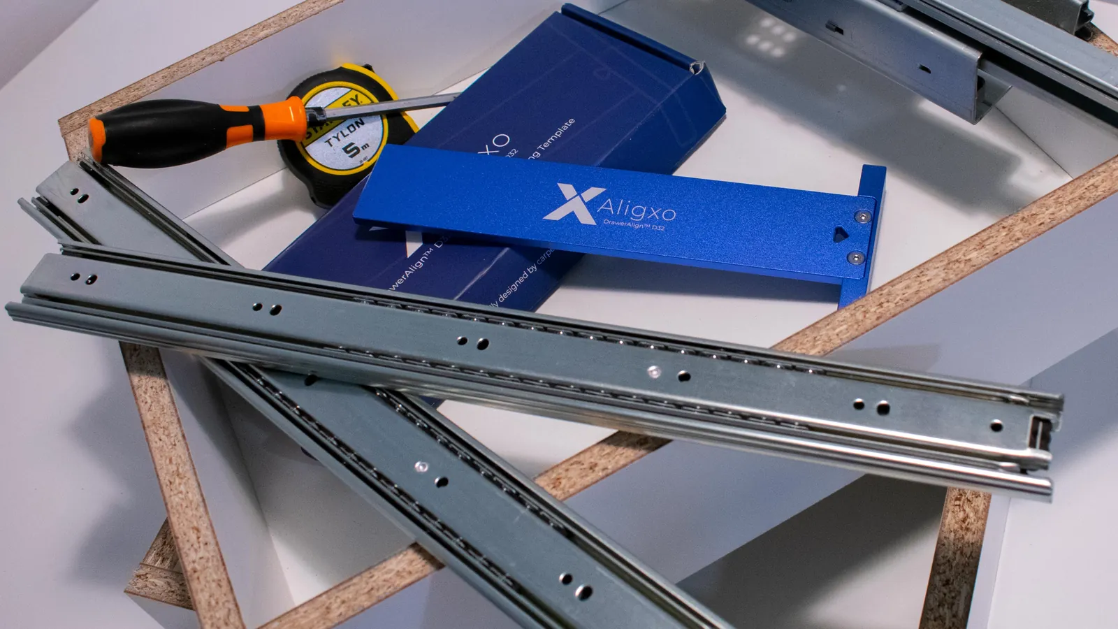 DrawerAlign D32 with ball-bearing side-mount slides, tape measure and screwdriver